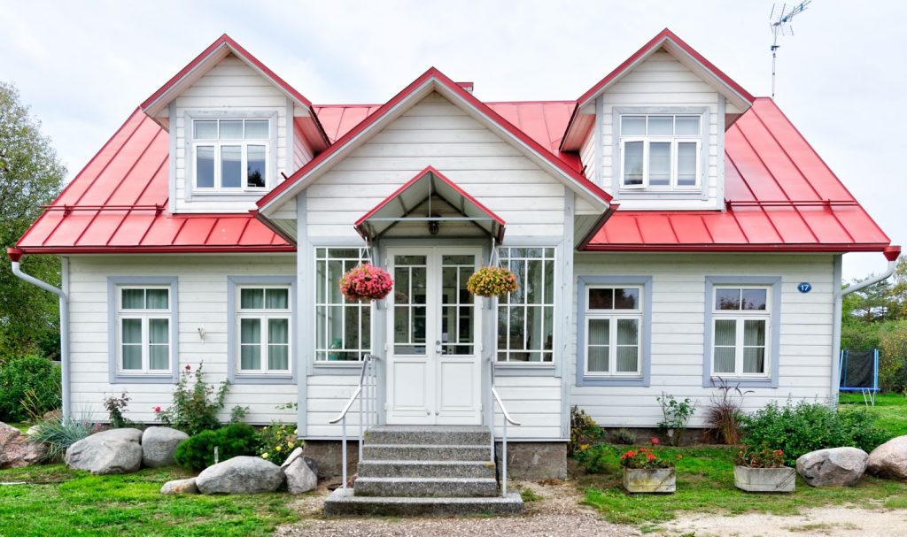 a white home with a red roof