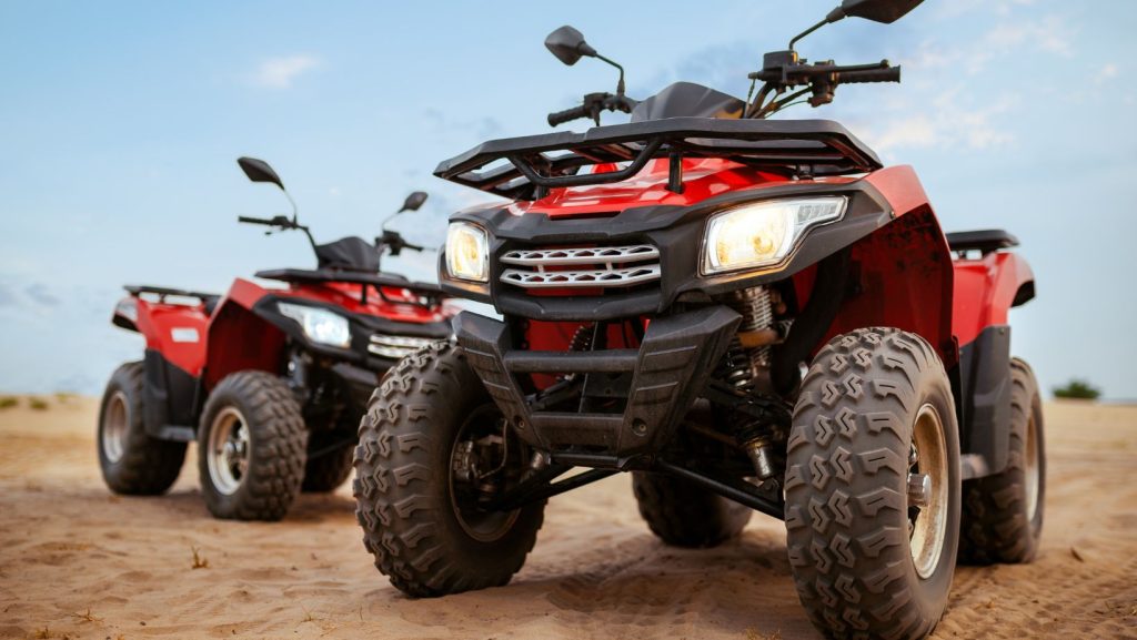 two red atvs