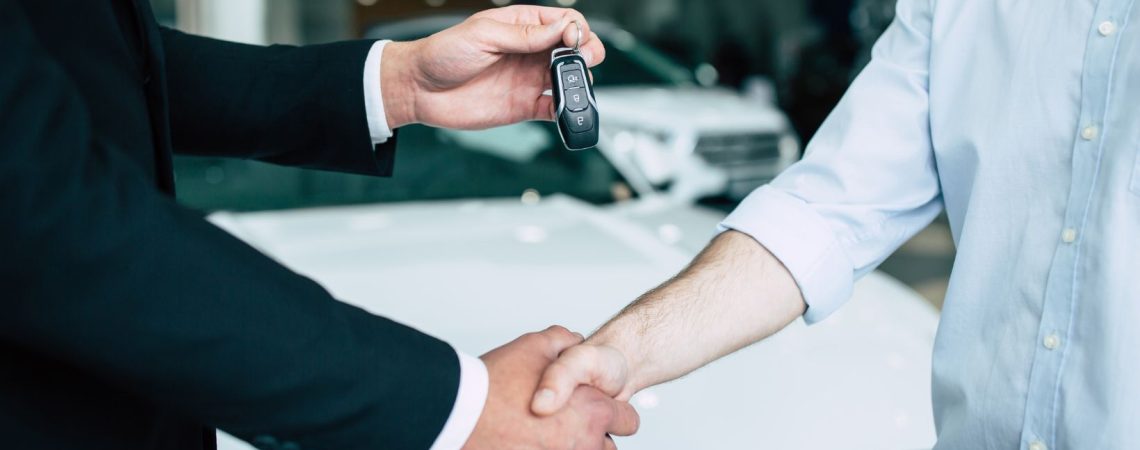 dealer handing over car keys