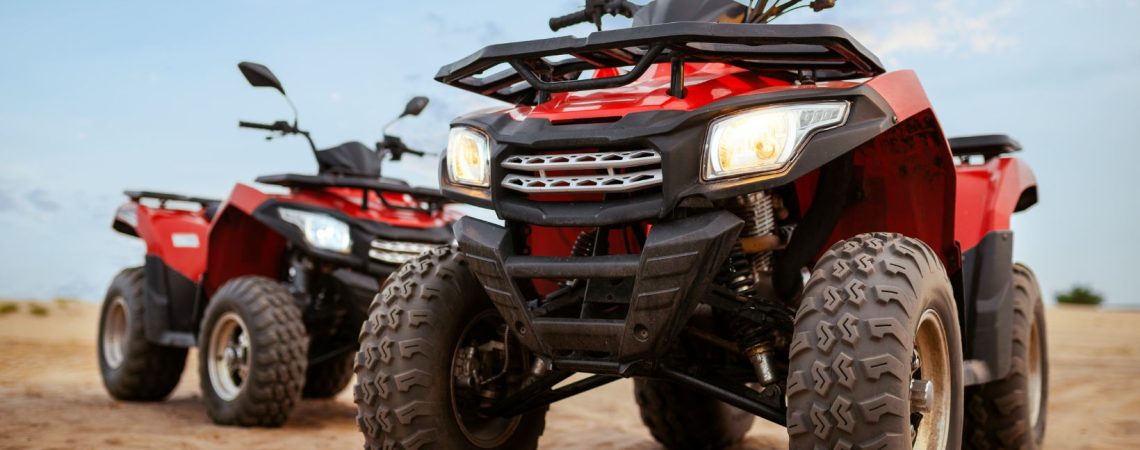 two red atvs